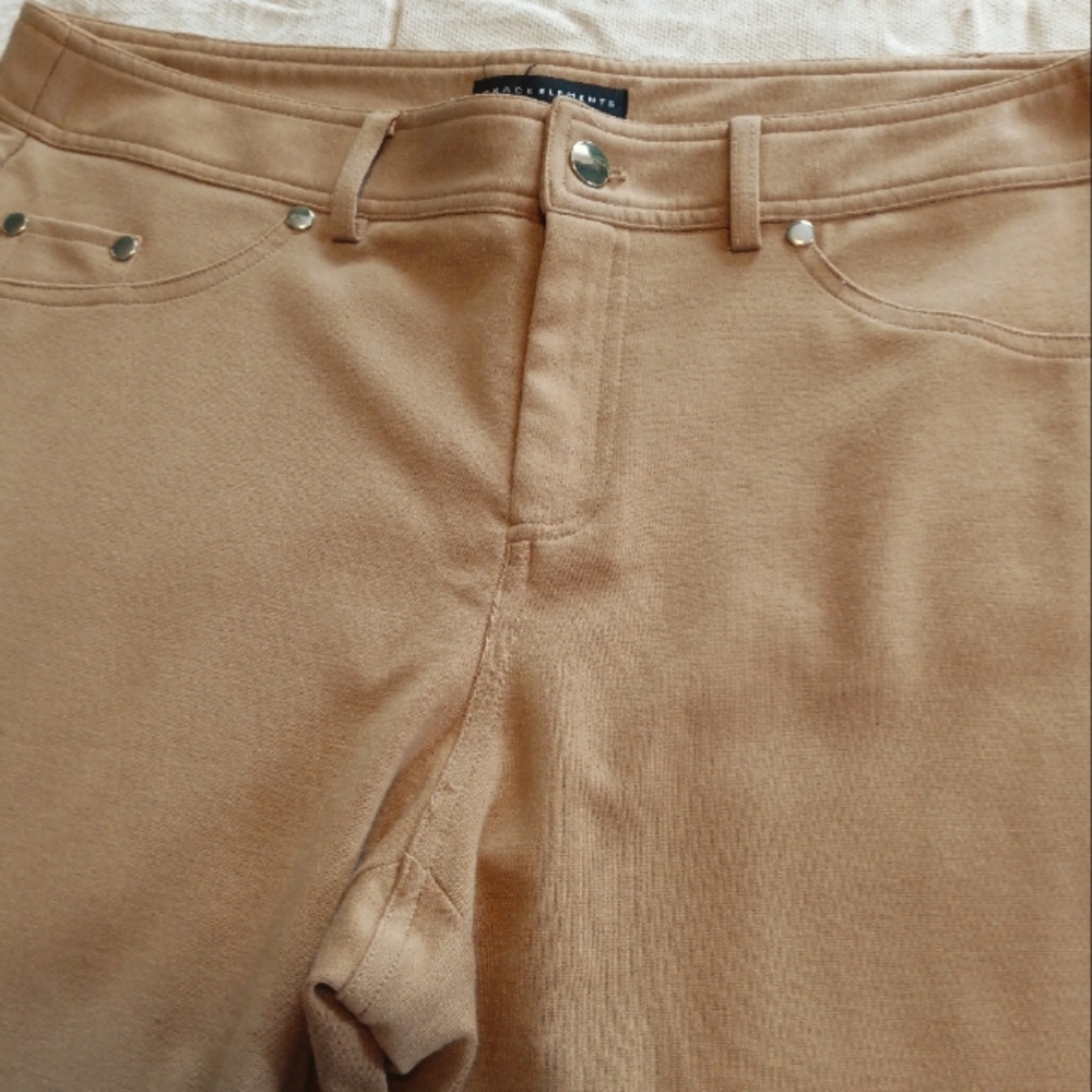 Tan pants 97% polyester, 3% spandex.